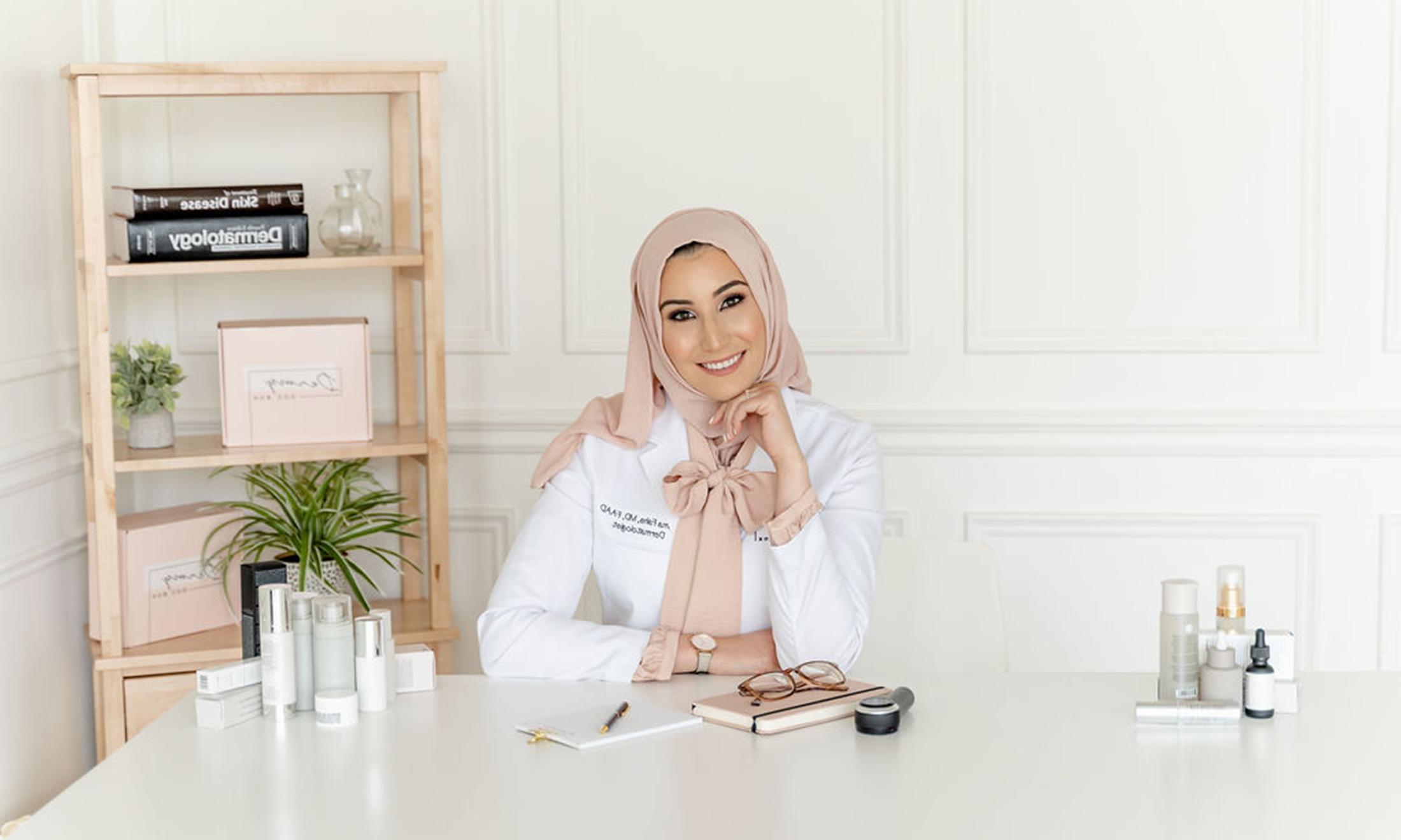 OUWB alumnae Fatima Fahs, M.D., poses at a desk