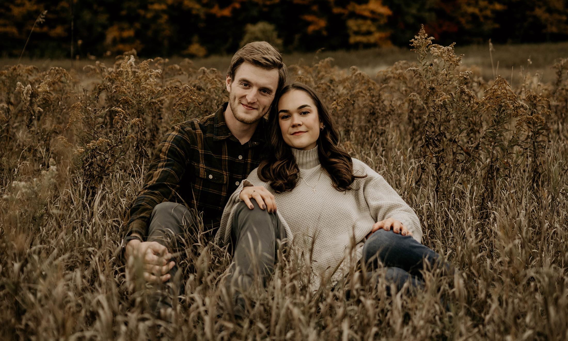 An image of Jessica and Andrew in a field